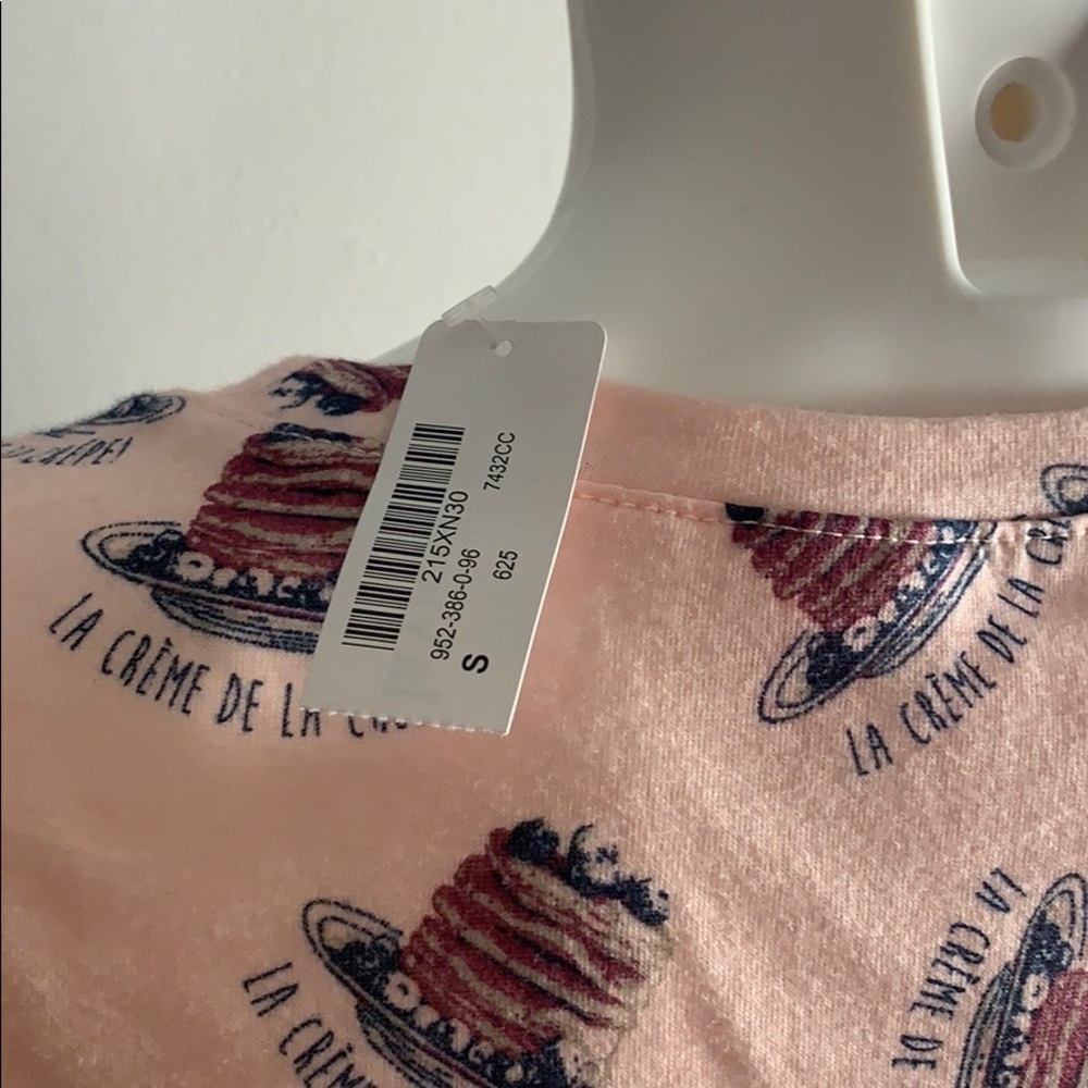 Two Crème de la Crêpe T Shirts .
